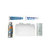 Collection of personal care products including a tube of toothpaste, a bottle, a pouch, and a canister on a white background.